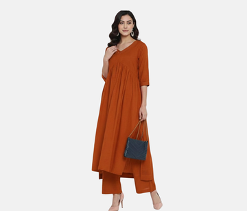 Paris Tip  Rest Orange Stylish Cambric Cotton V-Neck Kurta Set With Silver Stitch Lines Paired With Comfortable Pants
